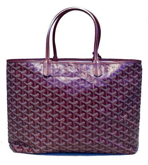 goyard tote with snap closure.